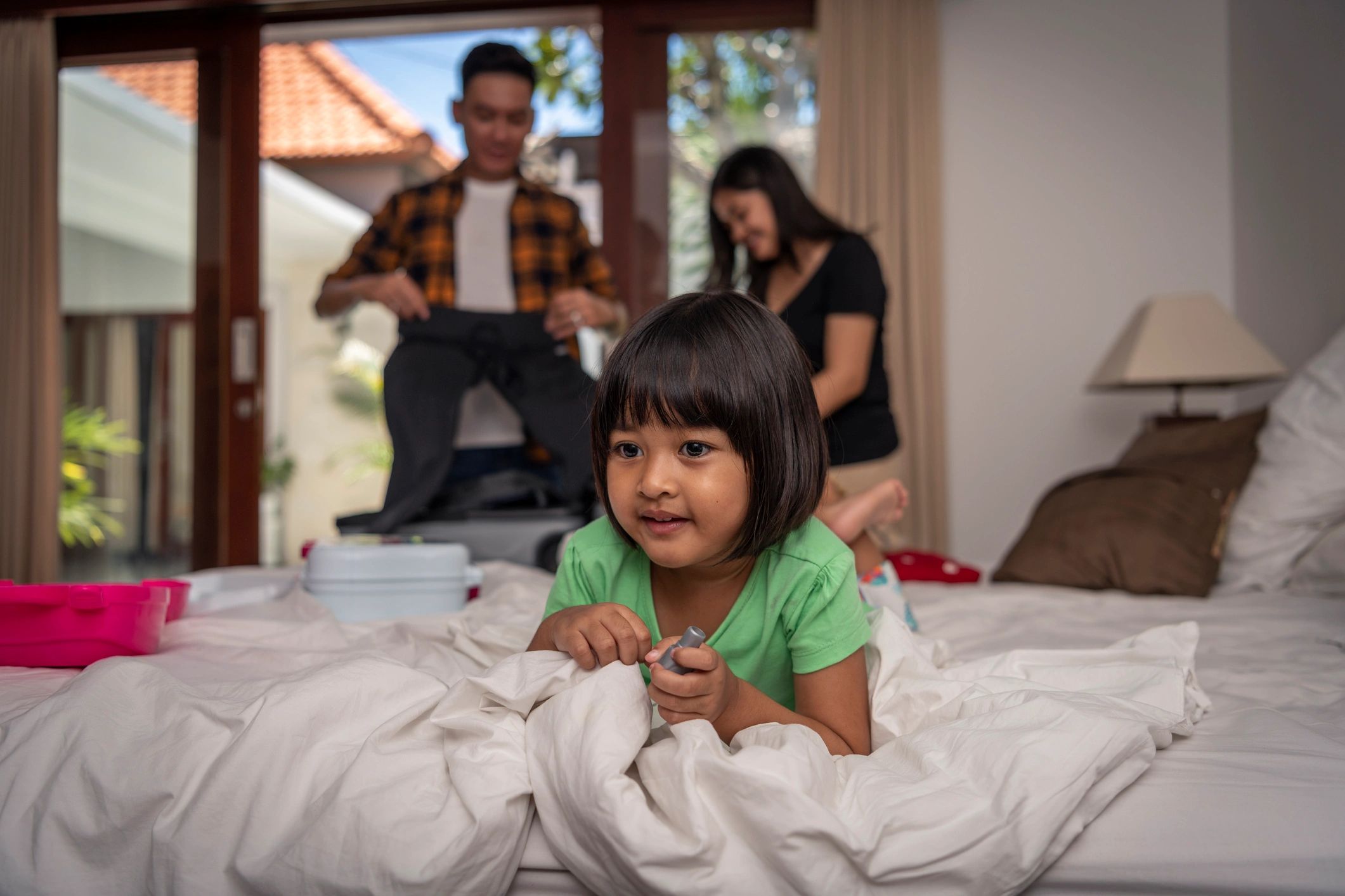 Child resting on a bed used as a testimonial avatar image