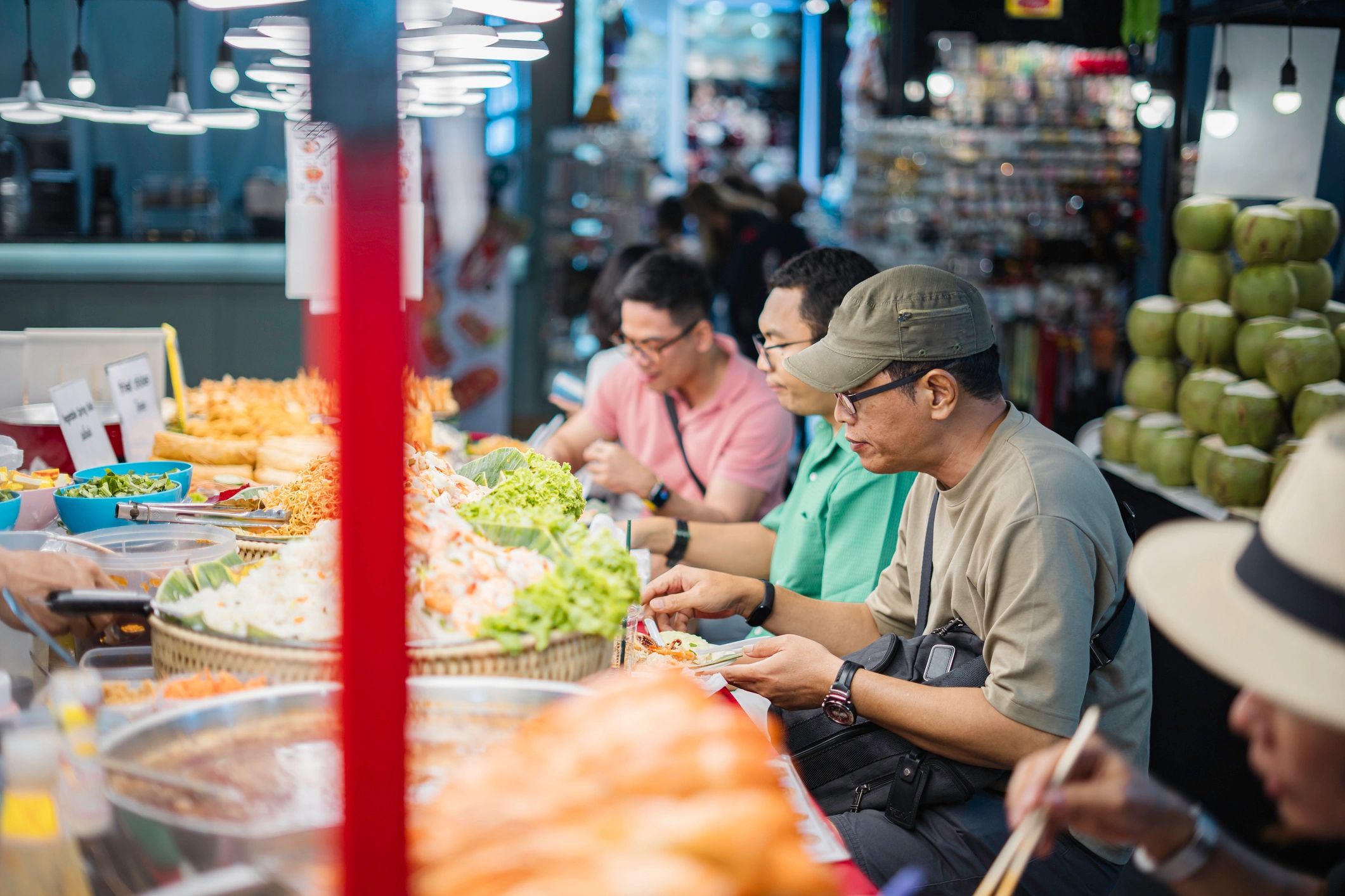 Traveler buying street food at a Thai night market
