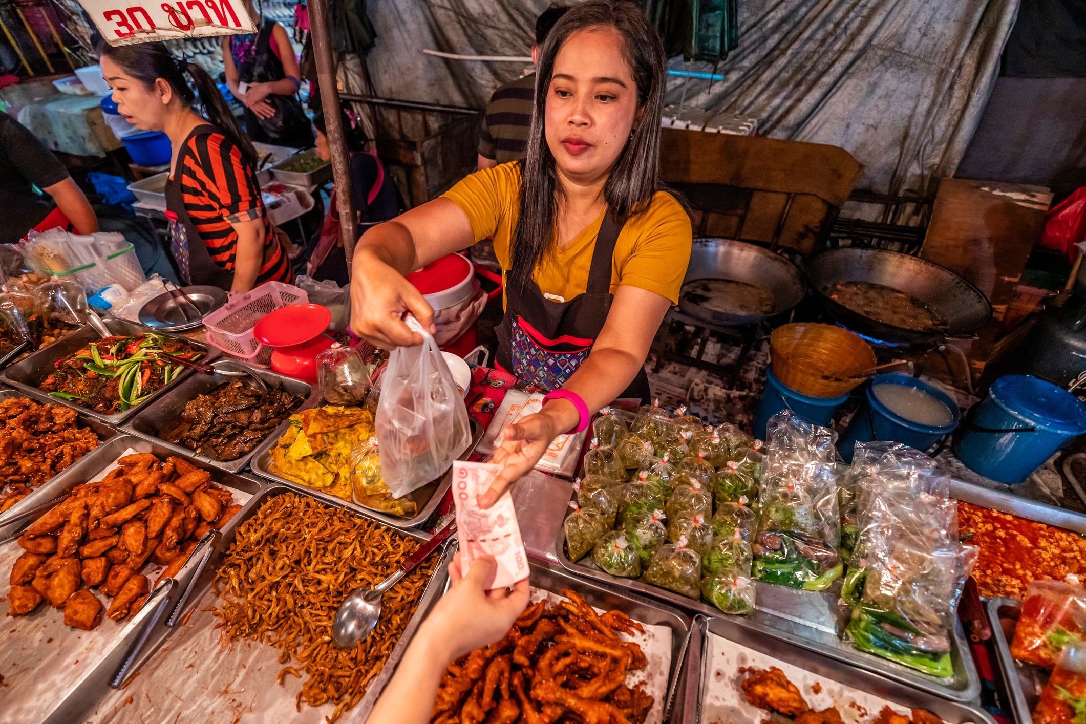 Thai street food vendors at a night market
