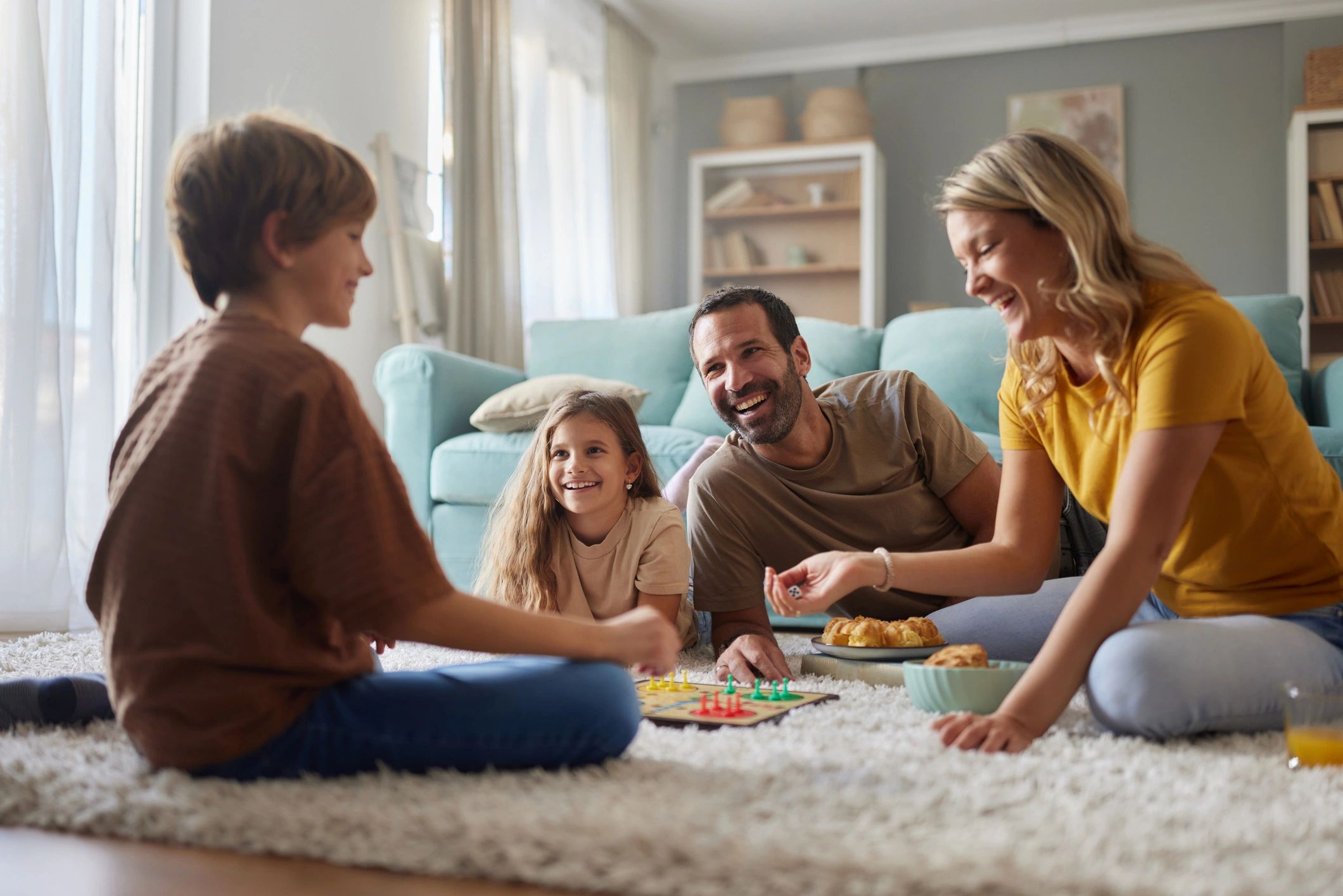 Family playing a board game together indoors