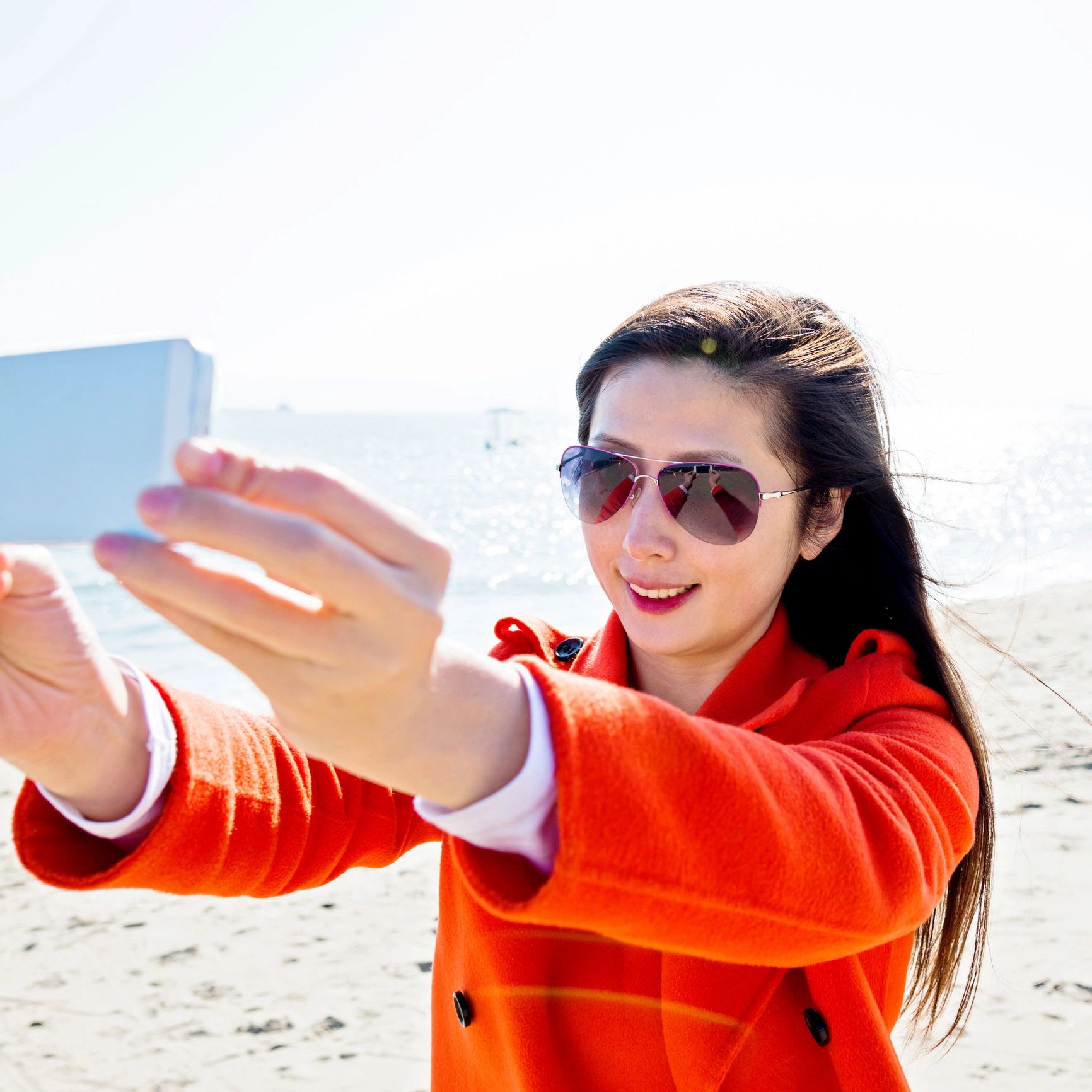 Traveler taking a selfie on the beach