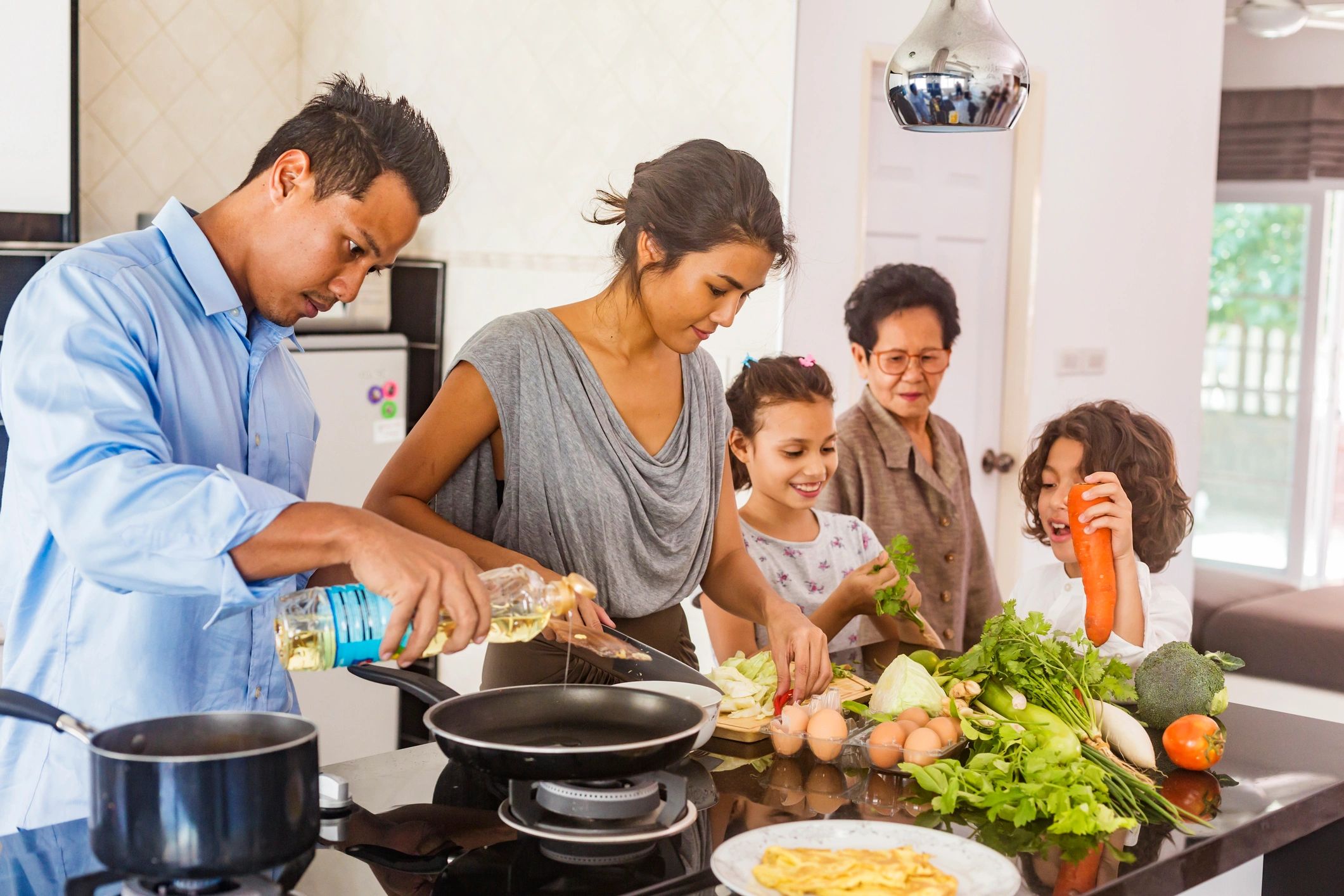 Family cooking together in a home kitchen